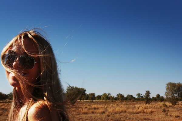 Girl with glasses in nature