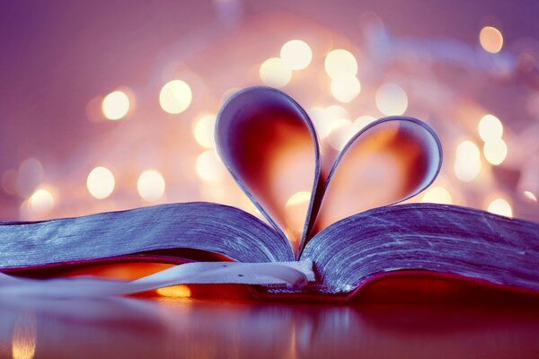 The leaves of the book folded in the form of a heart