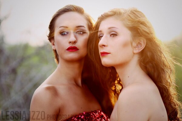 Two young girls looking into the distance