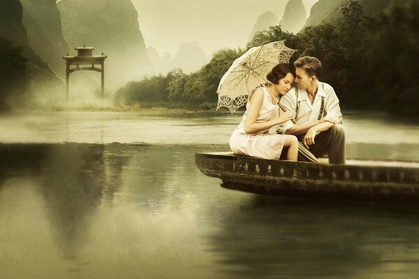 A couple of lovers in a boat on the river