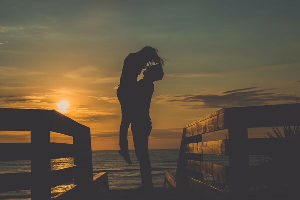 Love by the lake at sunset