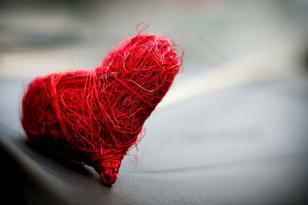 Red heart made of thread