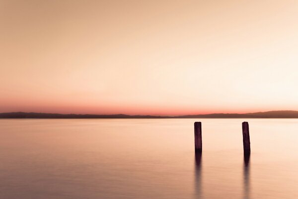 The surface of the lake on the background of sunset