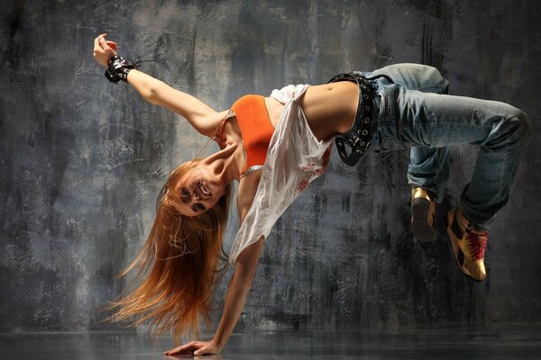 Girl with long red hair dancing