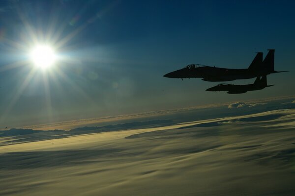 Jet aircraft flying behind the clouds