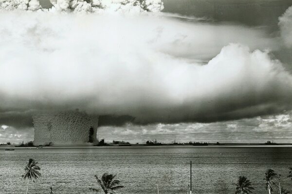 A black-and-white snapshot of a nuclear explosion. Nuclear mushroom on the water