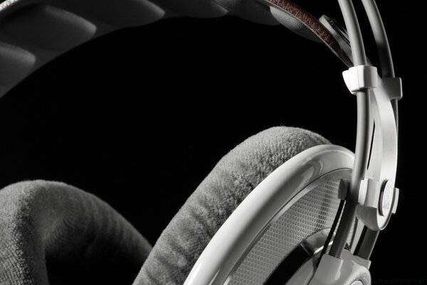 Large grey headphones on a black background