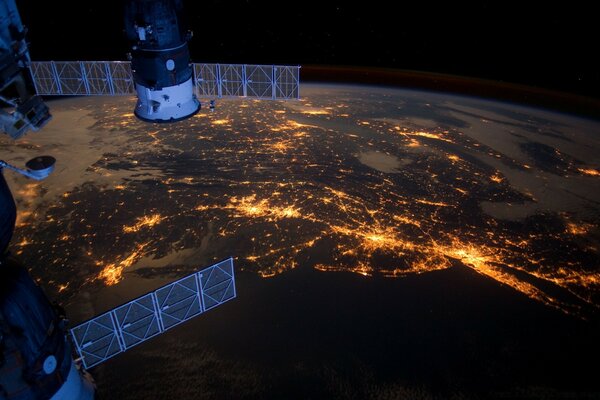 Spacecraft satellites on the background of the glowing moon