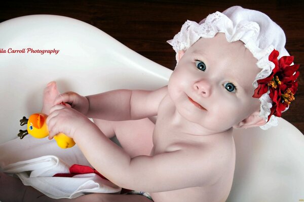 Cute baby in a white bathroom