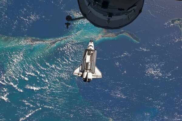 A spaceship over the ocean and an island