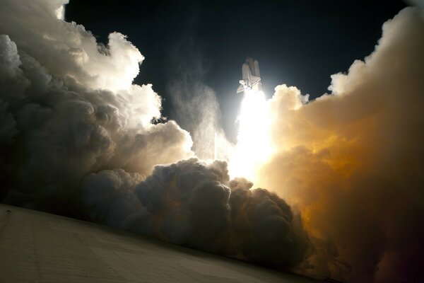 A rocket passing through the clouds