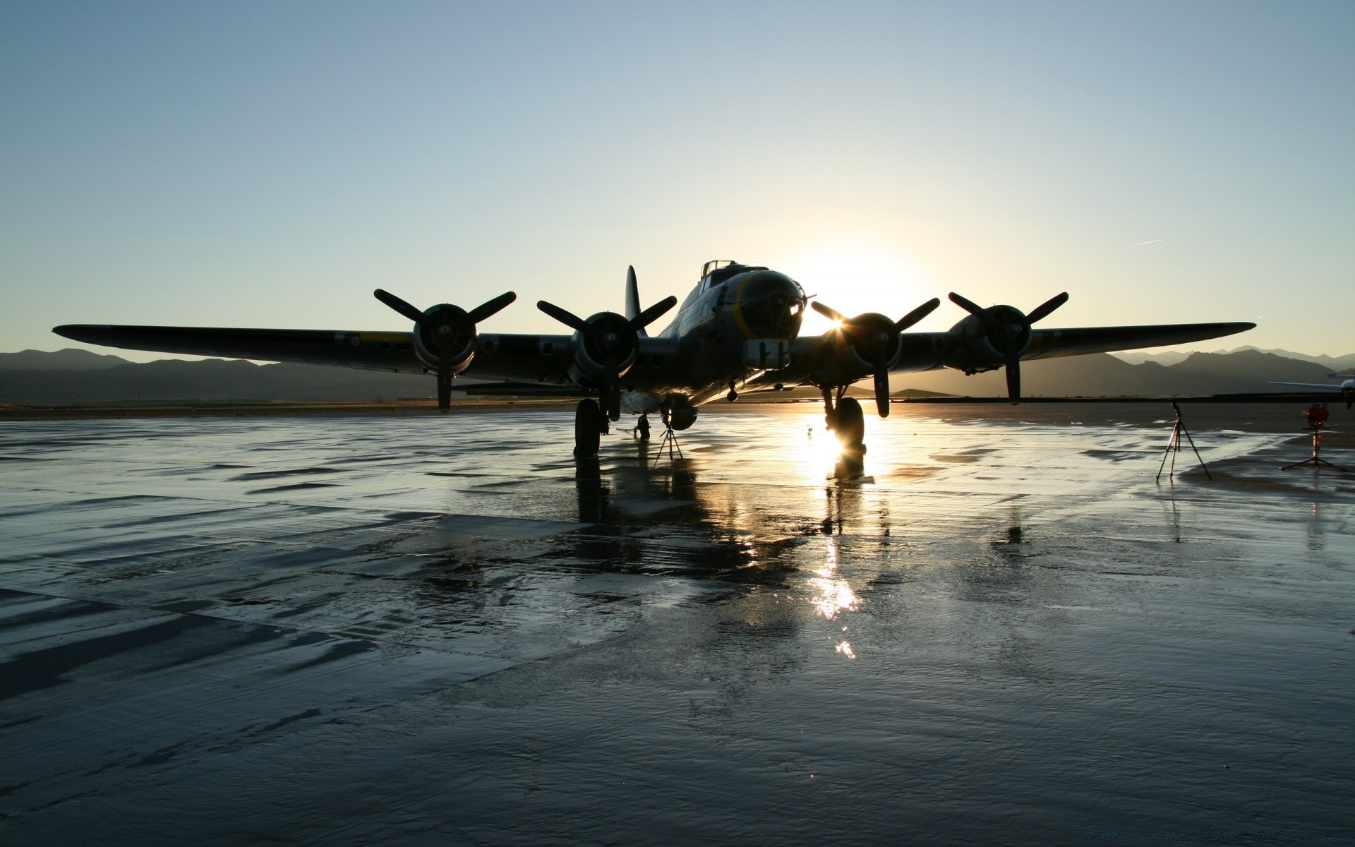 aviation water beach travel airplane sunset ocean aircraft sky dawn vehicle sand sea seashore sun evening transportation system outdoors