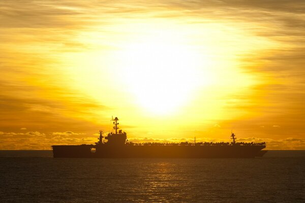 A warship on the background of dawn