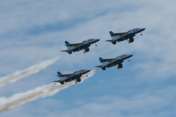 Four bombers soaring into the sky