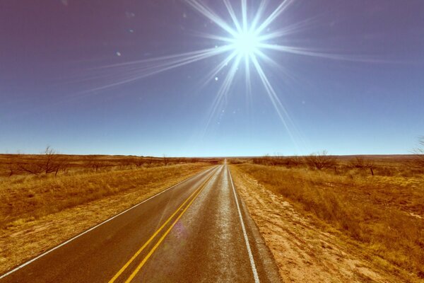 The road into the distance among the fields