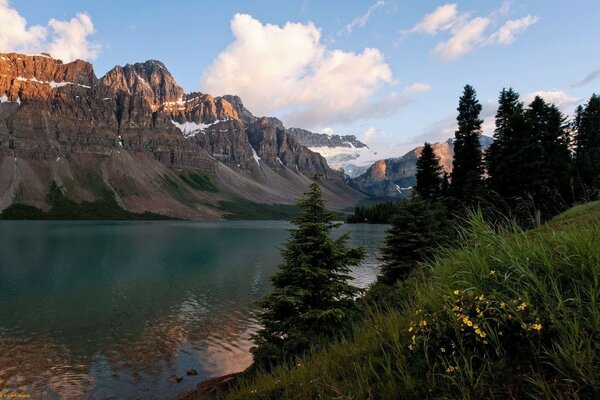 Sunset covers the pond and the mountains