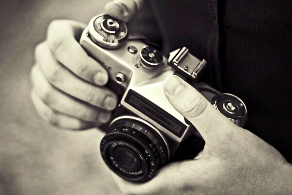 Vintage camera in hand