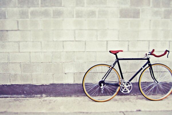 Retro photo. Bike against the wall