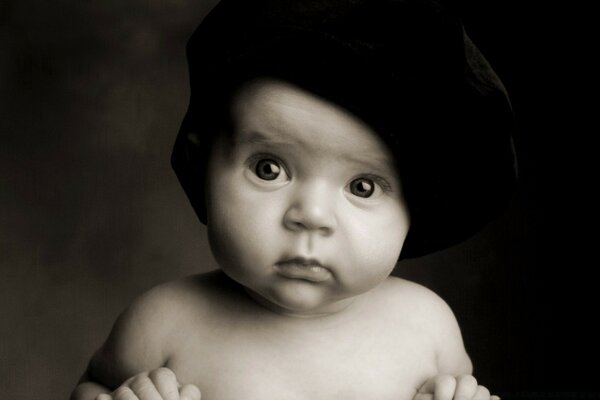 Portrait of a child monochrome in a hat