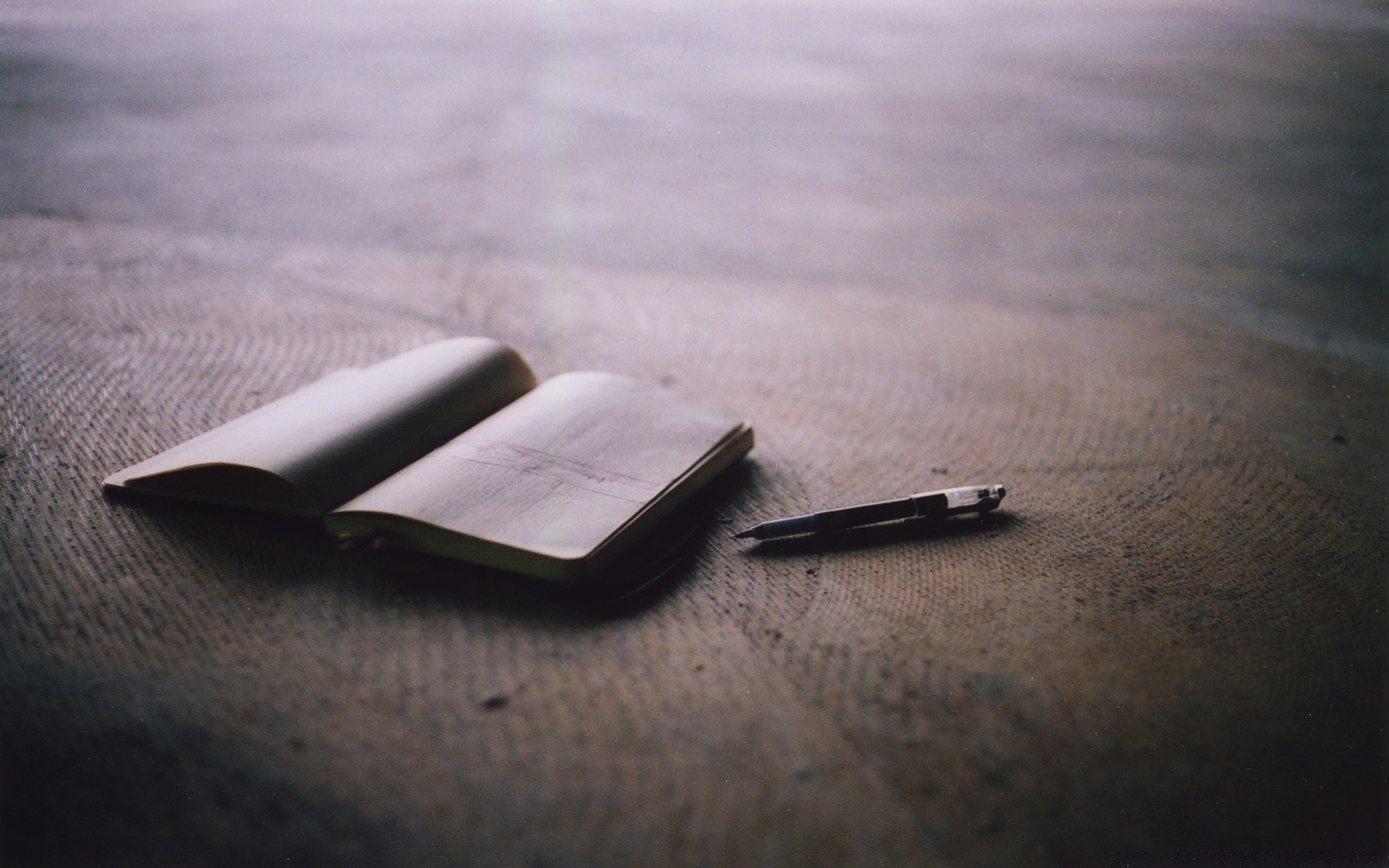 vintage still life beach composition laptop telephone blur business paper sand book recreation one