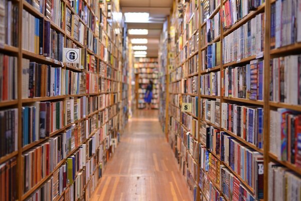 Shelves with books in a large library