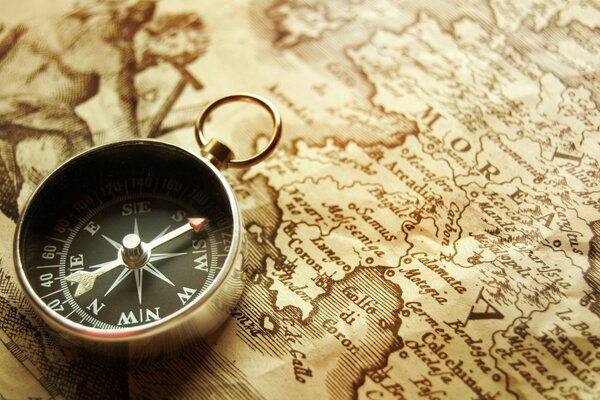 The compass is on a vintage map