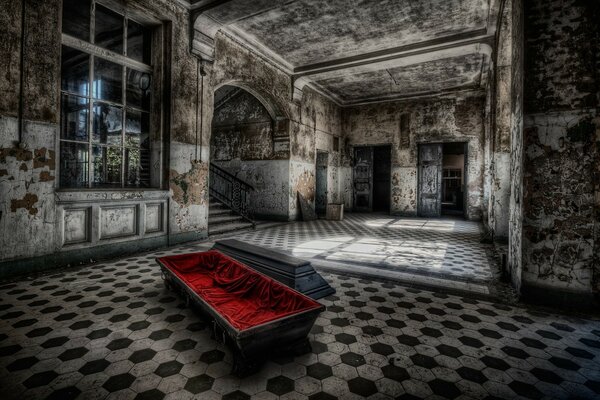 An old abandoned room with a coffin