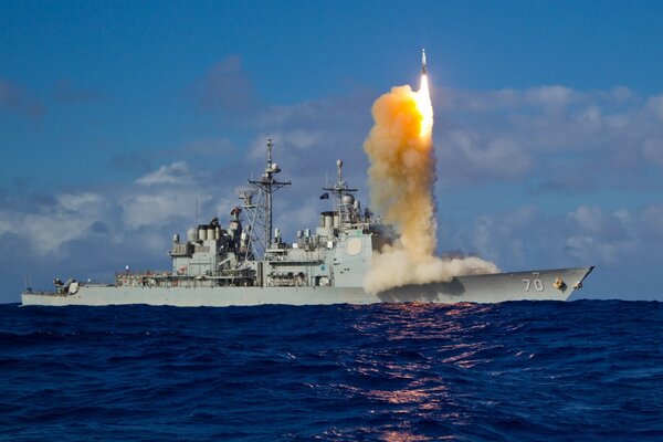 Practice shooting at sea from a warship