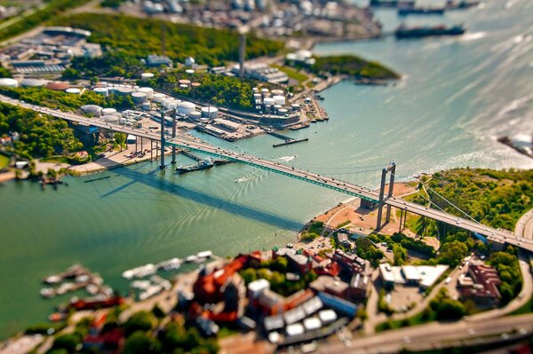 Long bridge over the river in the city