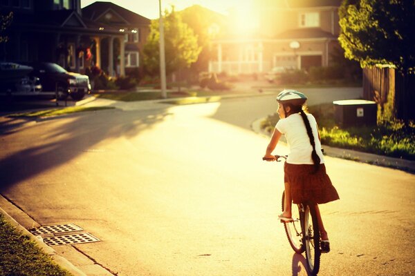 Bright sunny day sepia girl on bike