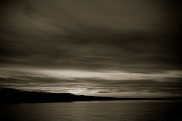 Black and white photo of the shore before the storm