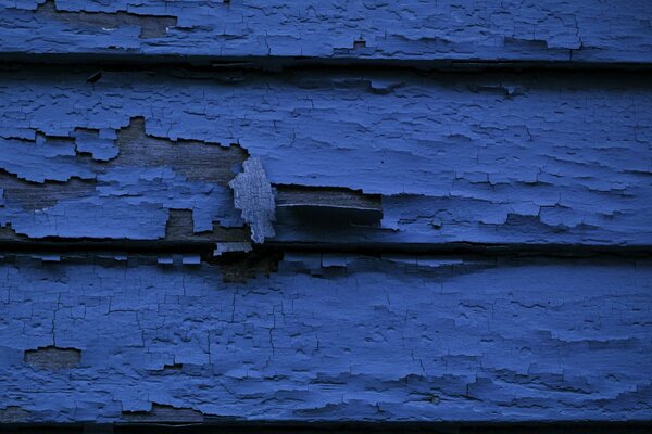 The paint has peeled off the texture of the house