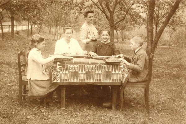 Family at the table in retro style