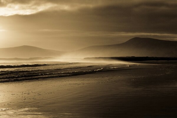 Sea waves roll onto the beach