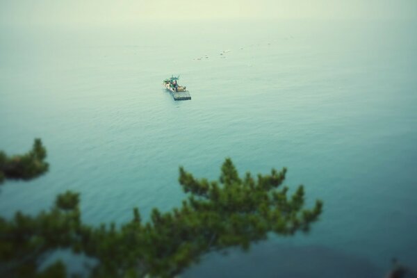 A boat is floating alone in the lake