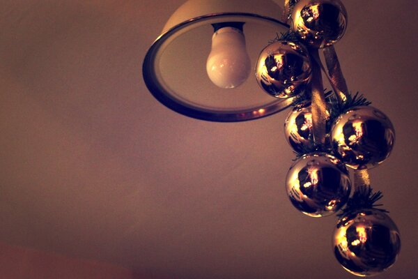 Decoration of the chandelier with Christmas balls