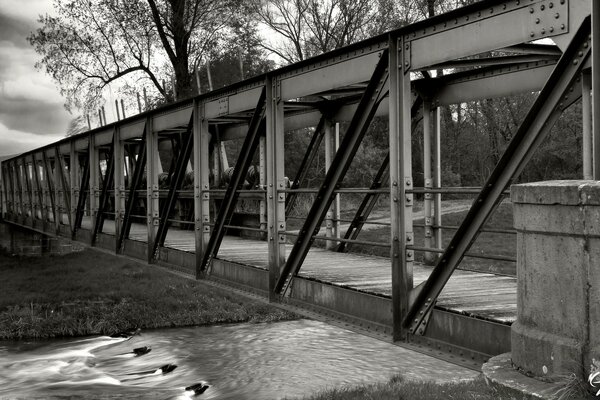 Vintage metal bridge across the river