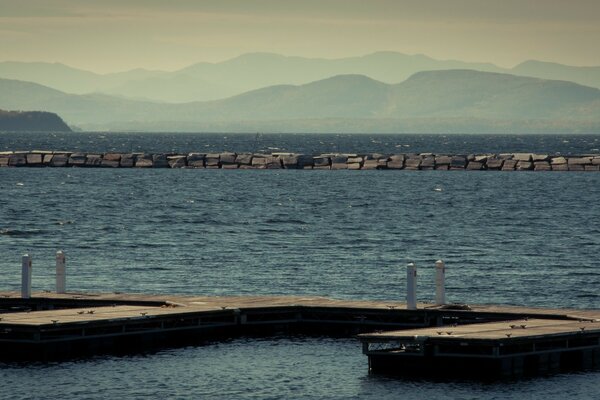 Berth on the seashore against the backdrop of mountains