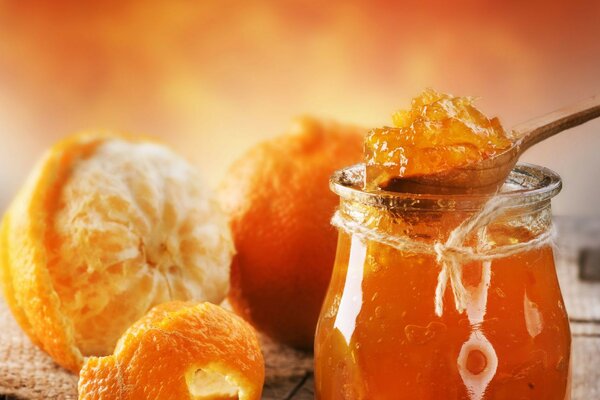 Honey on the background of oranges