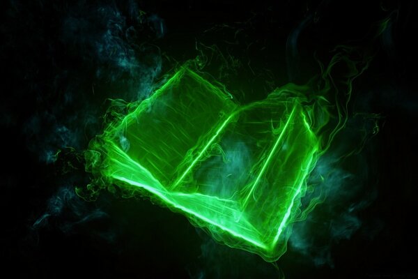 Libro luminoso verde en la oscuridad