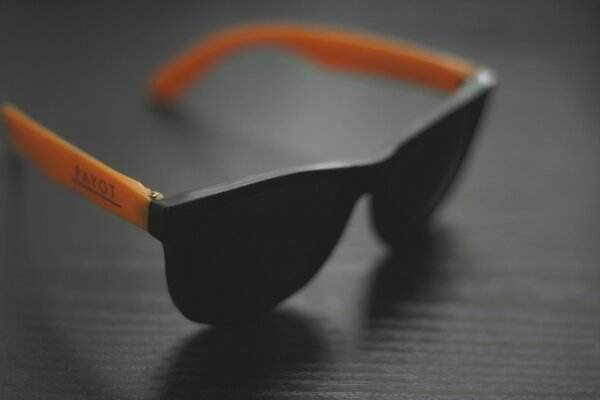 Still life sunglasses with orange shower