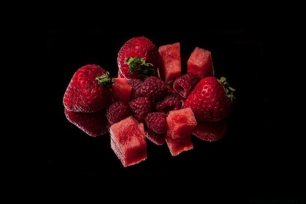 Fruits and berries on a black background