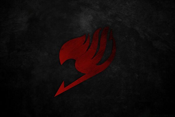 The symbol is red on a dark background