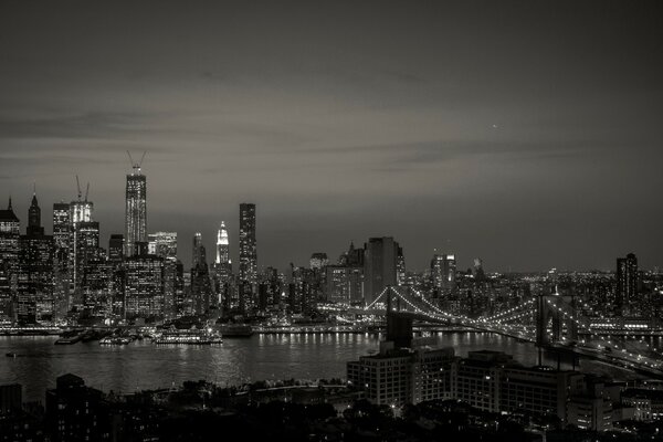 Black and white photo of skyscrapers at night