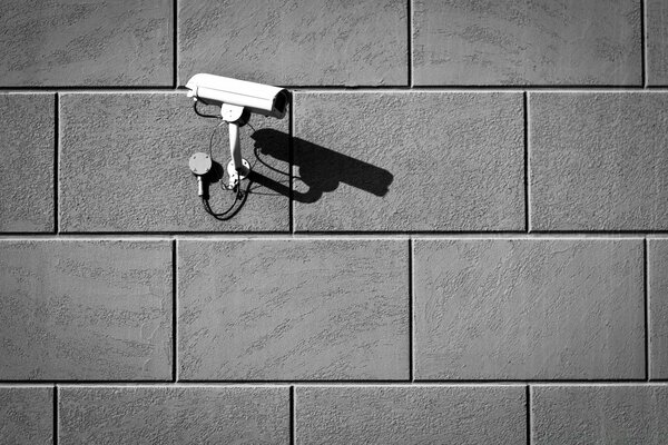 Black and white image of a surveillance camera