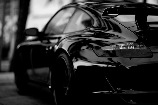 Racing car in black on a dark background