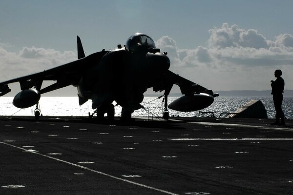 A fighter on an aircraft carrier a minute before takeoff