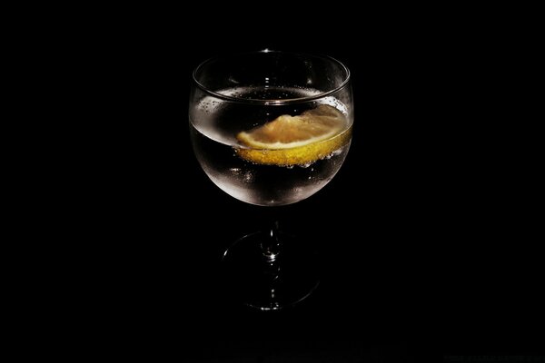 A glass of water with lemon