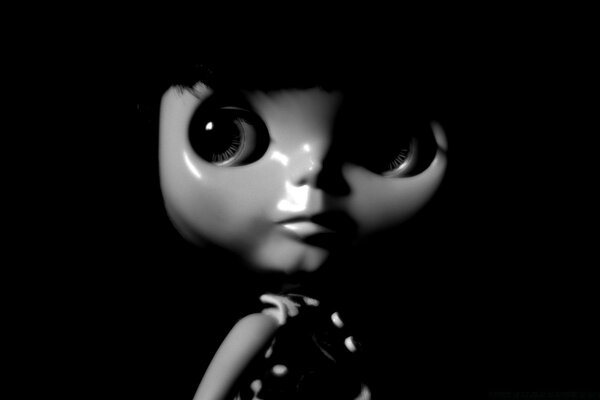 Black and white Portrait of a doll in the dark