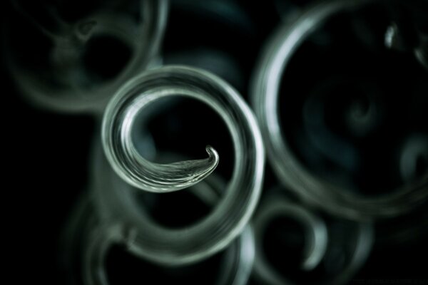 On a dark background - rings-curlicues